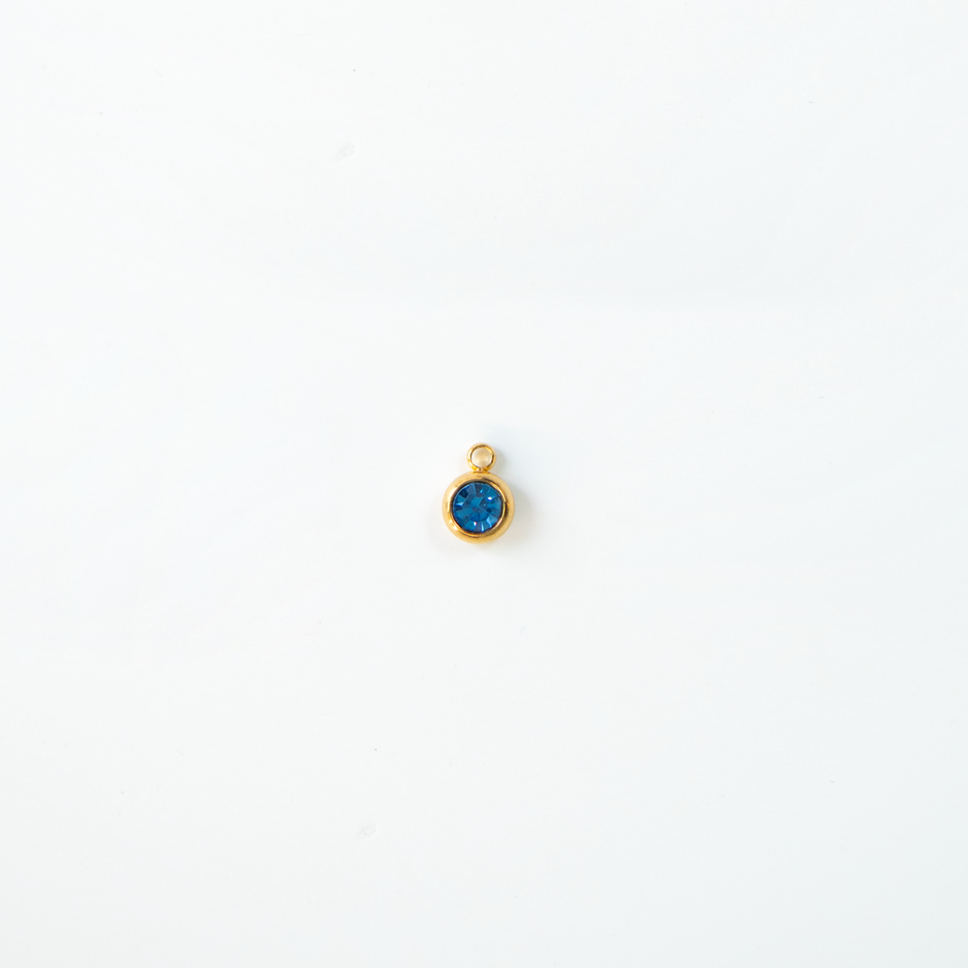 Charm del mes dorados