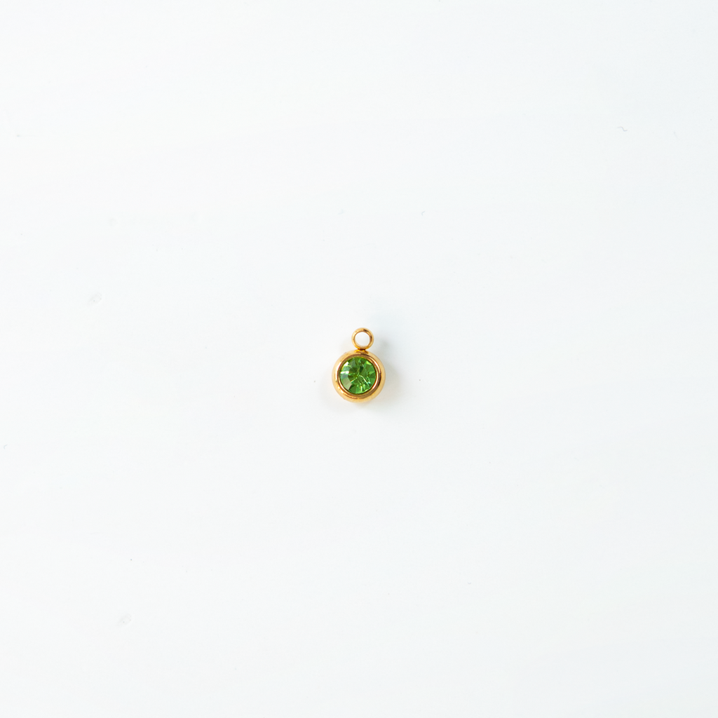 Charm del mes dorados