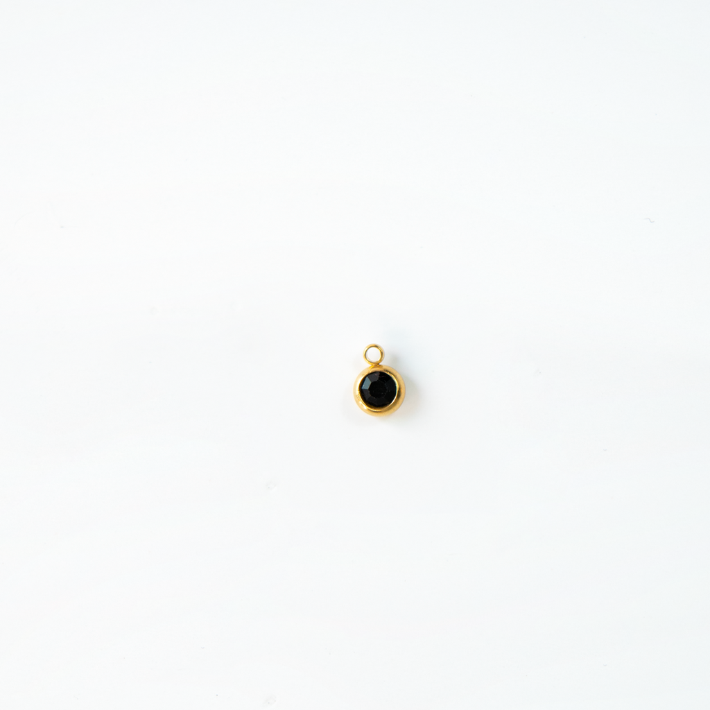 Charm del mes dorados
